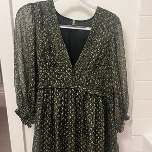 Long sleeve dress with gold-detailed fabric and sheer sleeves.